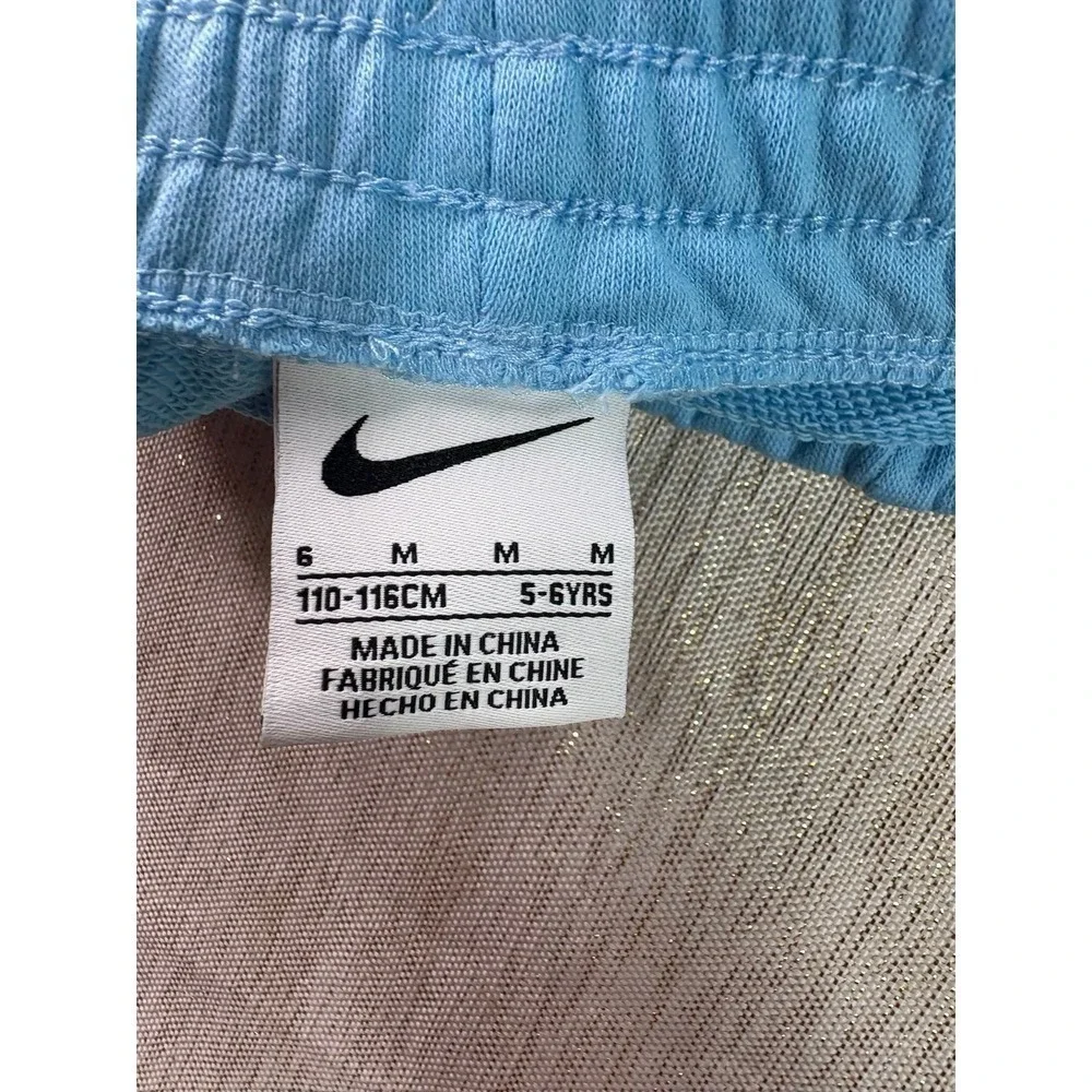 Two pairs of Nike baby blue short size 6